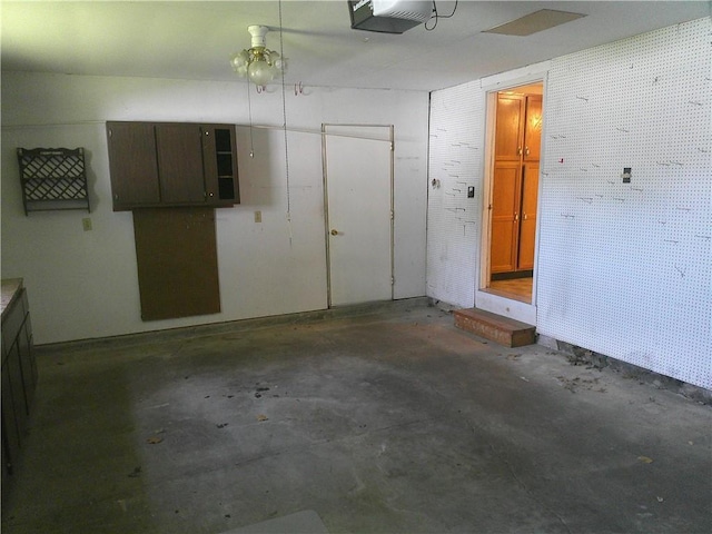 220 W State St, Erie, KS 66733 - garage featuring a garage door opener