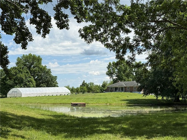 450 SW 725th Rd, Chilhowee, MO 64733 - view of green lawn with a water view, an outdoor structure, and an exterior structure