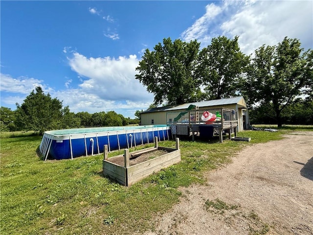 450 SW 725th Rd, Chilhowee, MO 64733 - view of front of property featuring a front yard, an outdoor pool, and a vegetable garden