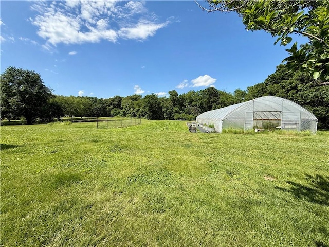 450 SW 725th Rd, Chilhowee, MO 64733 - view of green lawn with a greenhouse and an outdoor structure