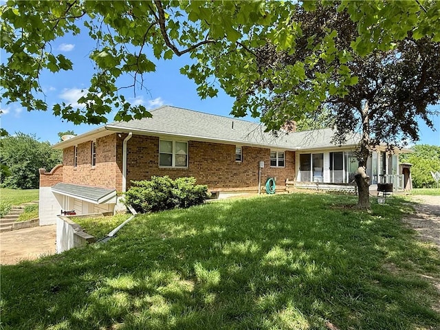 450 SW 725th Rd, Chilhowee, MO 64733 - view of front facade featuring a front yard, brick siding, and a chimney