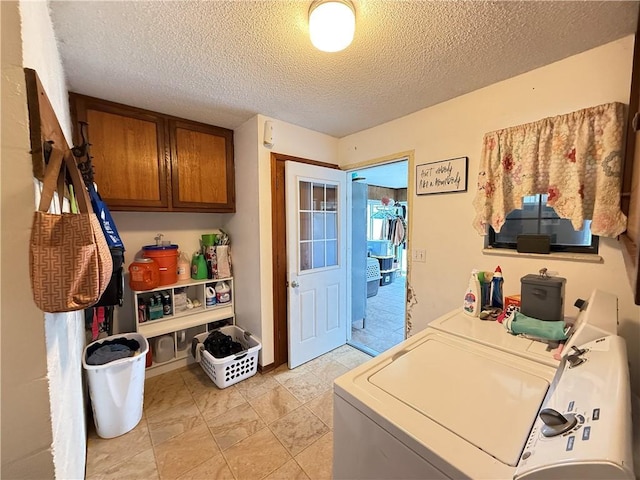 450 SW 725th Rd, Chilhowee, MO 64733 - laundry area featuring cabinet space, washing machine and dryer, and a textured ceiling