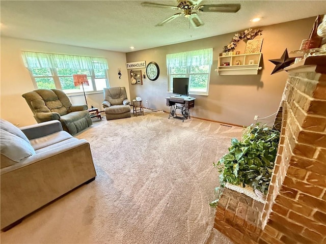 450 SW 725th Rd, Chilhowee, MO 64733 - carpeted living area featuring plenty of natural light, a ceiling fan, a fireplace, baseboards, and recessed lighting