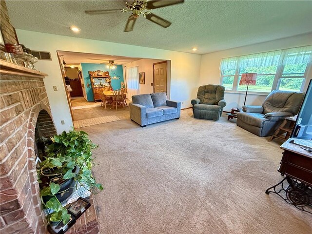 450 SW 725th Rd, Chilhowee, MO 64733 - living area with carpet flooring, a ceiling fan, a textured ceiling, a fireplace, and recessed lighting