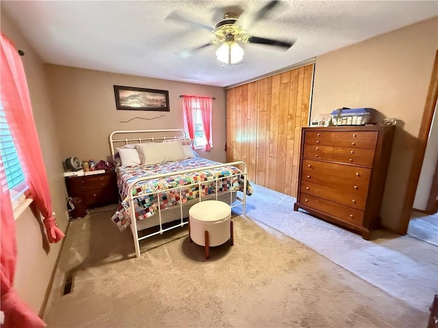 450 SW 725th Rd, Chilhowee, MO 64733 - carpeted bedroom featuring ceiling fan, a textured ceiling, and a closet