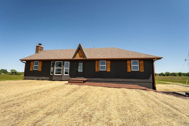 22102 E 291st St, Harrisonville, MO 64701 - view of front of house featuring a chimney and roof with shingles
