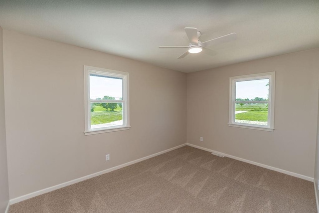 22102 E 291st St, Harrisonville, MO 64701 - carpeted empty room with baseboards and ceiling fan