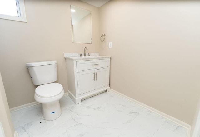 22102 E 291st St, Harrisonville, MO 64701 - bathroom with marble finish floors, toilet, vanity, and baseboards