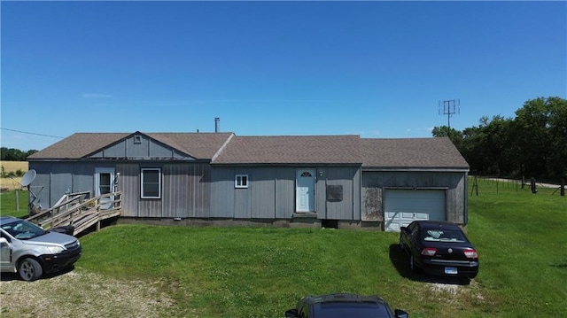 34330 W 407th St, Osawatomie, KS 66064 - ranch-style house featuring an attached garage, a front yard, and roof with shingles