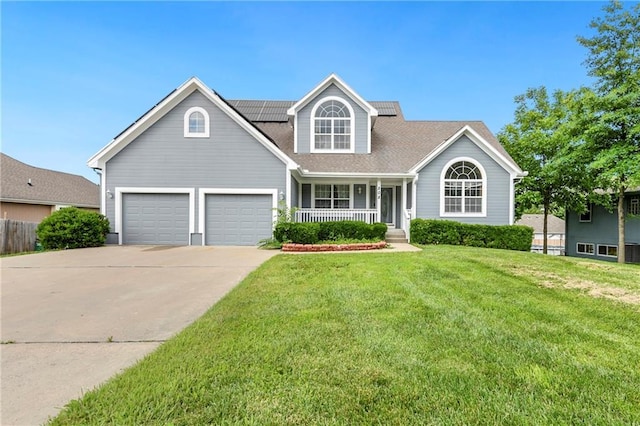 808 S Peculiar Dr, Peculiar, MO 64078 - traditional-style house with a porch, concrete driveway, and solar panels