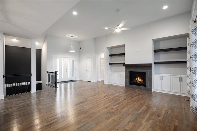 8316 NW 90th St, Kansas City, MO 64153 - unfurnished living room featuring ceiling fan, wood finished floors, baseboards, a tile fireplace, and recessed lighting