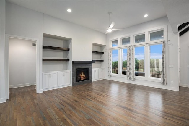8316 NW 90th St, Kansas City, MO 64153 - unfurnished living room with a ceiling fan, a tile fireplace, dark wood-style flooring, baseboards, and recessed lighting
