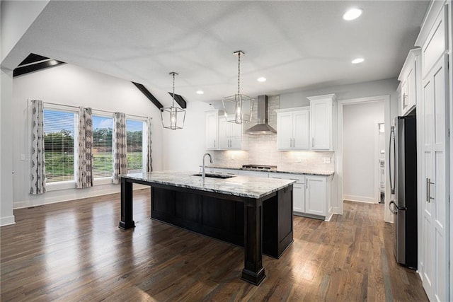8316 NW 90th St, Kansas City, MO 64153 - kitchen with appliances with stainless steel finishes, wall chimney range hood, a sink, tasteful backsplash, and light stone counters