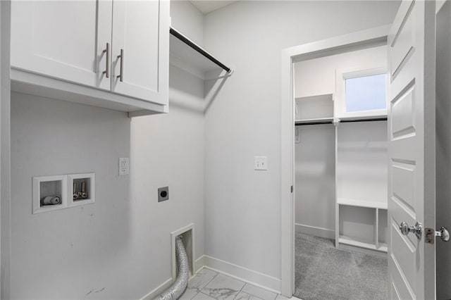 8316 NW 90th St, Kansas City, MO 64153 - laundry area with hookup for an electric dryer, cabinet space, baseboards, light marble finish flooring, and washer hookup