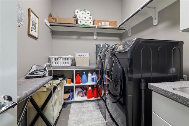 8605 NE Shl Creek Pkwy, Kansas City, MO 64157 - laundry area with washer and clothes dryer and tile patterned flooring
