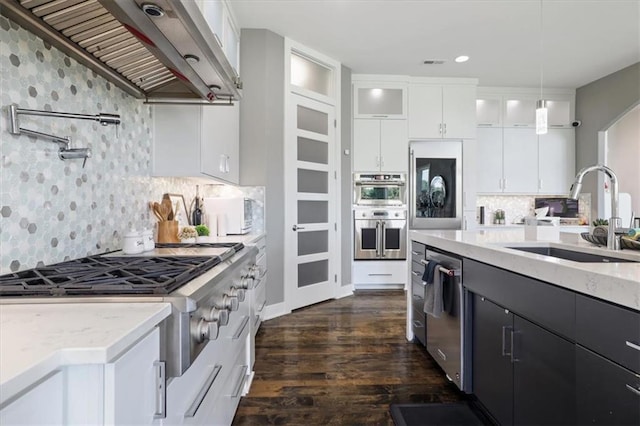 8605 NE Shl Creek Pkwy, Kansas City, MO 64157 - kitchen featuring custom range hood, a sink, stainless steel appliances, dark wood-style flooring, and white cabinetry