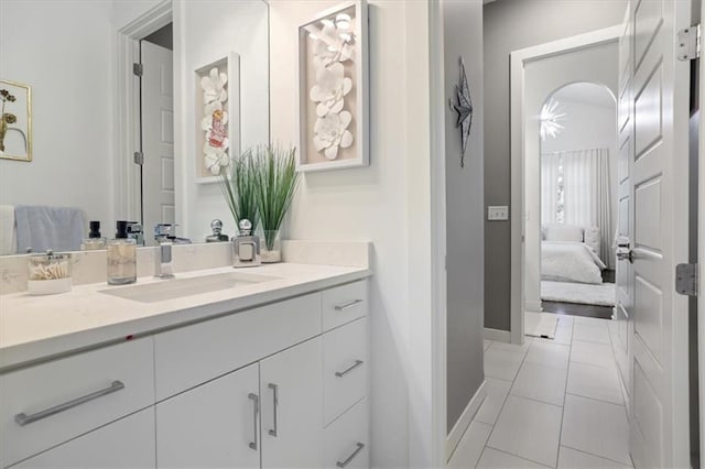 8605 NE Shl Creek Pkwy, Kansas City, MO 64157 - ensuite bathroom with vanity, baseboards, and tile patterned floors
