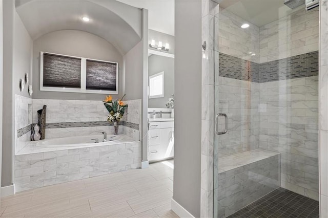 8605 NE Shl Creek Pkwy, Kansas City, MO 64157 - bathroom with a garden tub, a stall shower, vanity, baseboards, and recessed lighting