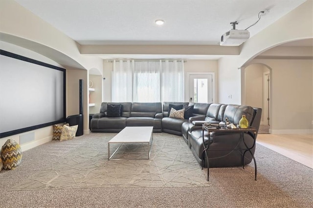 8605 NE Shl Creek Pkwy, Kansas City, MO 64157 - carpeted home theater featuring arched walkways and baseboards