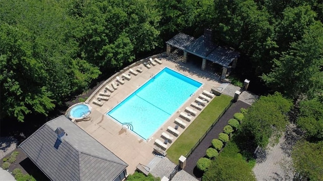 8605 NE Shl Creek Pkwy, Kansas City, MO 64157 - community pool featuring a patio and an outdoor structure