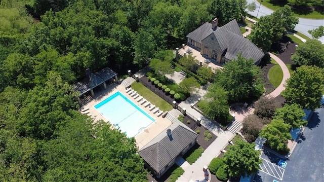 8605 NE Shl Creek Pkwy, Kansas City, MO 64157 - aerial view of property and surrounding area featuring a pool