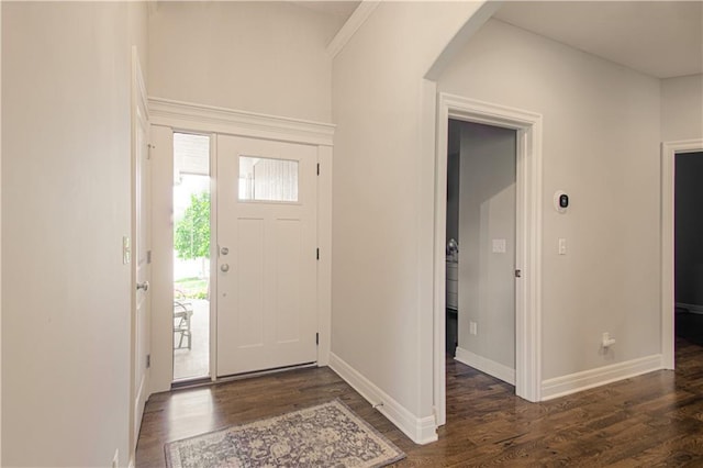 25383 W 144th Ct, Olathe, KS 66061 - foyer featuring arched walkways, dark wood-style flooring, and baseboards