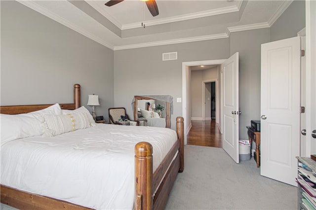 25383 W 144th Ct, Olathe, KS 66061 - bedroom featuring a raised ceiling, light carpet, ornamental molding, and a ceiling fan