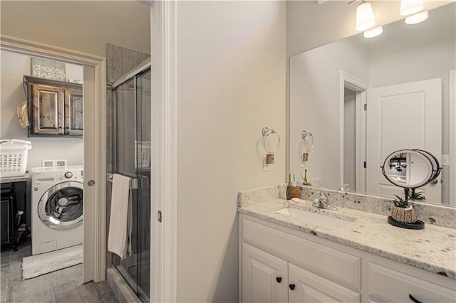 25383 W 144th Ct, Olathe, KS 66061 - bathroom with washer / clothes dryer, vanity, and a shower stall