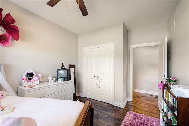 25383 W 144th Ct, Olathe, KS 66061 - bedroom with dark wood-style flooring, baseboards, and a ceiling fan