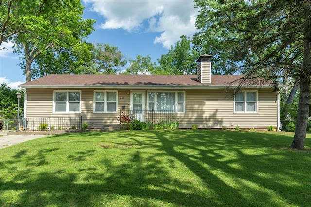 8401 England St, Overland Park, KS 66212 - ranch-style house with a front yard and a chimney