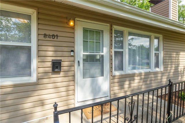 8401 England St, Overland Park, KS 66212 - property entrance with a chimney