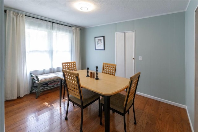 8401 England St, Overland Park, KS 66212 - dining space with wood-type flooring, ornamental molding, and baseboards