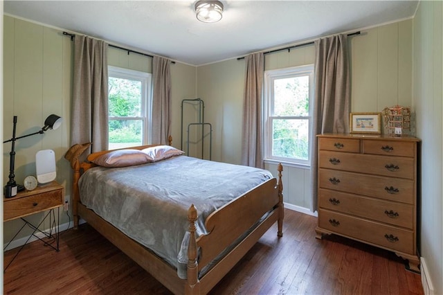8401 England St, Overland Park, KS 66212 - bedroom featuring dark wood-style flooring and baseboards