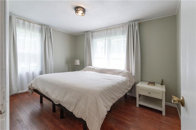 8401 England St, Overland Park, KS 66212 - bedroom with wood finished floors and ornamental molding