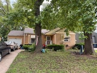 7231 Forest Ave, Kansas City, MO 64131 - single story home featuring an attached garage and concrete driveway