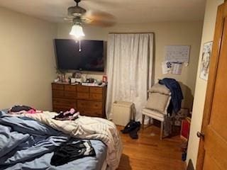 7231 Forest Ave, Kansas City, MO 64131 - bedroom with wood finished floors and ceiling fan