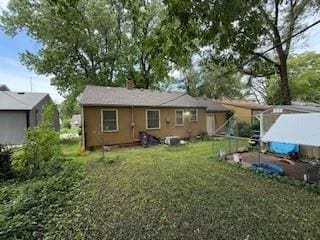 7231 Forest Ave, Kansas City, MO 64131 - back of house featuring a chimney