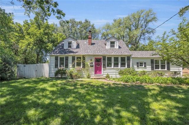 10916 Grandview Rd, Kansas City, MO 64137 - cape cod-style house with a chimney