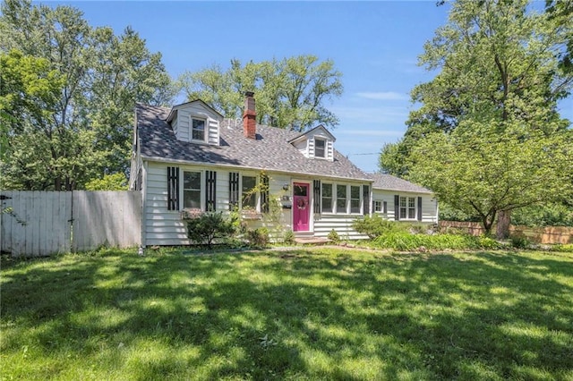 10916 Grandview Rd, Kansas City, MO 64137 - cape cod house featuring a chimney