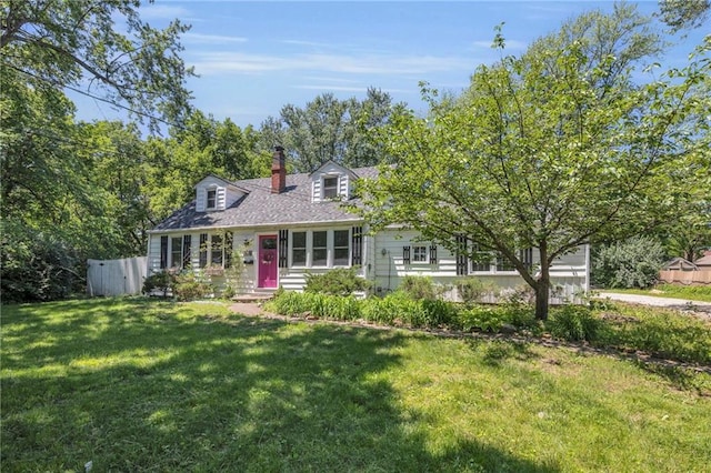 10916 Grandview Rd, Kansas City, MO 64137 - cape cod home with a chimney