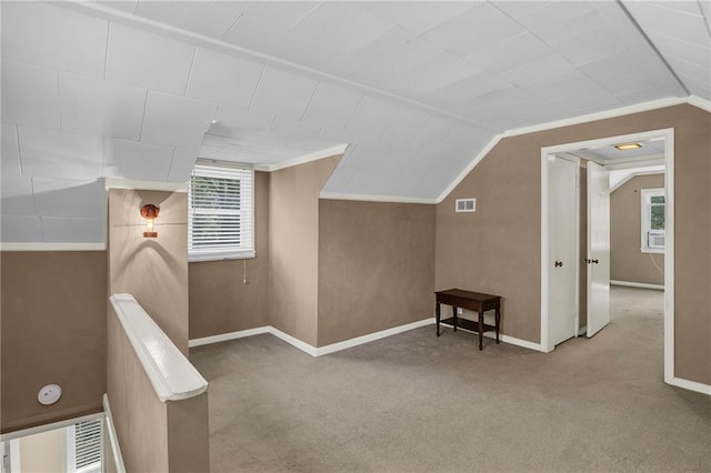 10916 Grandview Rd, Kansas City, MO 64137 - additional living space with carpet, lofted ceiling, and baseboards