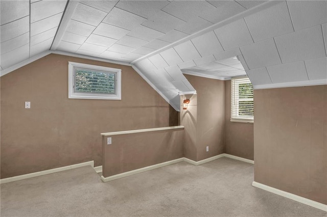10916 Grandview Rd, Kansas City, MO 64137 - bonus room featuring carpet, lofted ceiling, and baseboards