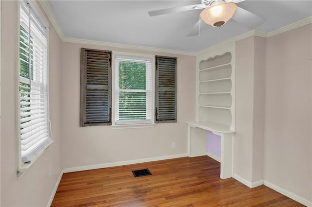 10916 Grandview Rd, Kansas City, MO 64137 - empty room with wood finished floors, baseboards, a ceiling fan, and ornamental molding