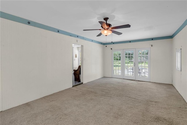 10916 Grandview Rd, Kansas City, MO 64137 - empty room with carpet flooring and ceiling fan