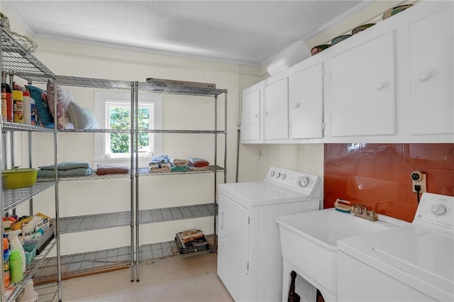 10916 Grandview Rd, Kansas City, MO 64137 - laundry room with washer and dryer and cabinet space