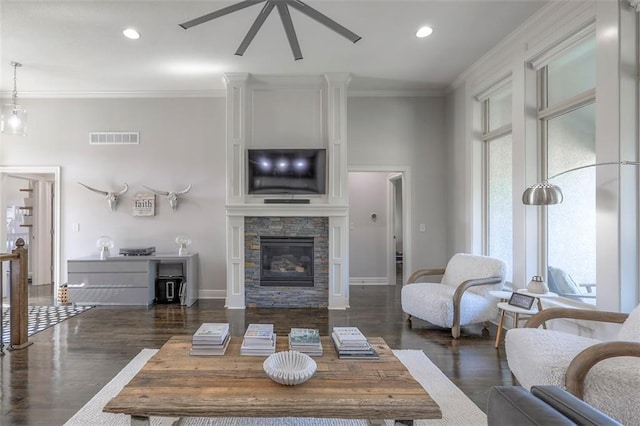 1644 Woodland Shores Cir, Lees Summit, MO 64086 - living room with a stone fireplace, wood finished floors, crown molding, recessed lighting, and ceiling fan