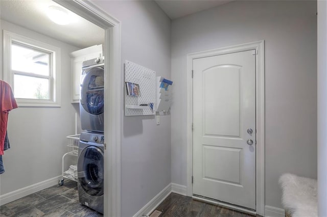 1644 Woodland Shores Cir, Lees Summit, MO 64086 - laundry room with stacked washing machine and dryer and baseboards