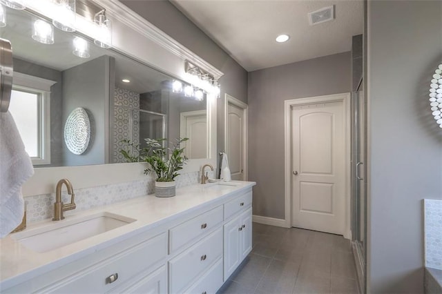 1644 Woodland Shores Cir, Lees Summit, MO 64086 - bathroom featuring double vanity, a stall shower, tile patterned floors, and baseboards