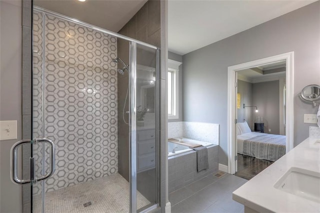 1644 Woodland Shores Cir, Lees Summit, MO 64086 - bathroom featuring a bath, a stall shower, tile patterned floors, and ensuite bath