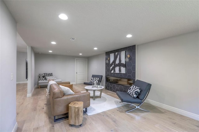 1644 Woodland Shores Cir, Lees Summit, MO 64086 - living room with wood finished floors, baseboards, and recessed lighting